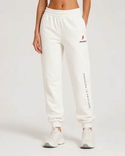 PROSIDZ women’s cream joggers with Pressure Is Privilege leg print, elastic waistband, side pockets, and cuffed ankles