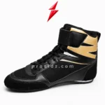 Prosidz Industries Professional Boxing Shoes showing a wide black ankle strap, gold panels, and contrasting white stitching.