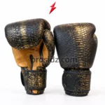 PSI Snake Boxing Gloves in black and metallic gold with embossed scale panels and padded knuckles