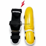 PSI yellow black MMA shin guards front view with molded protection shell