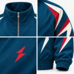 Close view of the teal fabric, stitching, and red and ivory angular shoulder panels on the PSI Prosidz Industries track jacket.