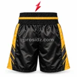 Four close-ups of PSI Boxing Shorts by Prosidz Industries showing gold waistband embroidery, charcoal side chevrons, leg branding, and hem stitching.