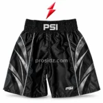 PSI boxing shorts by Prosidz Industries, front view with black satin-look fabric, silver geometric panels, stitched hems, and waistband branding.