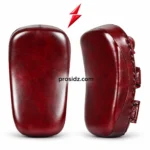 PSI and prosidz industries burgundy Muay Thai pads in front and angled views, with curved panels, side lacing, and a red logo above.